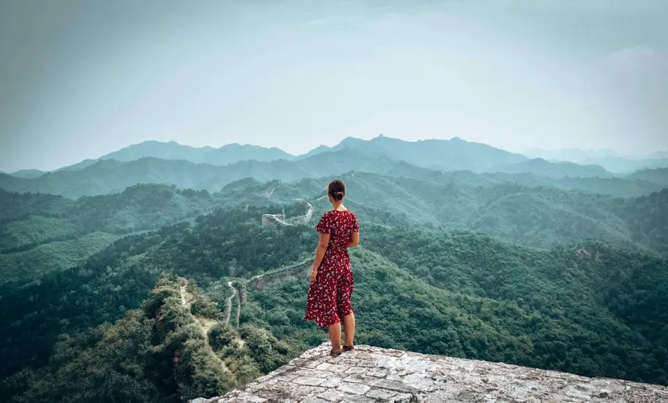 Picture of girl looking out at the Gubeikou section of the Great Wall of China