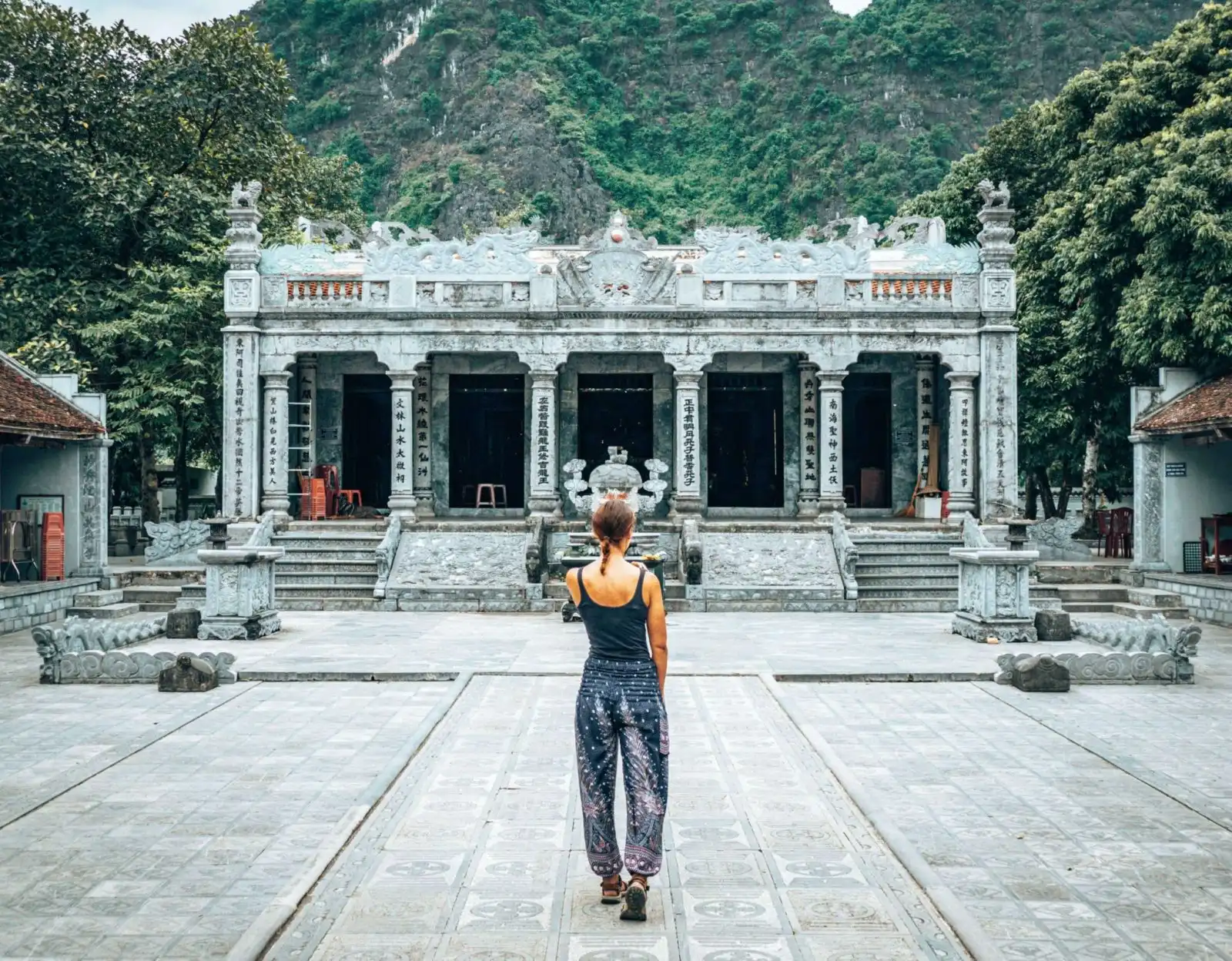 Girl in front of the Thai Vi Temple in Tam Coc, Vietnam