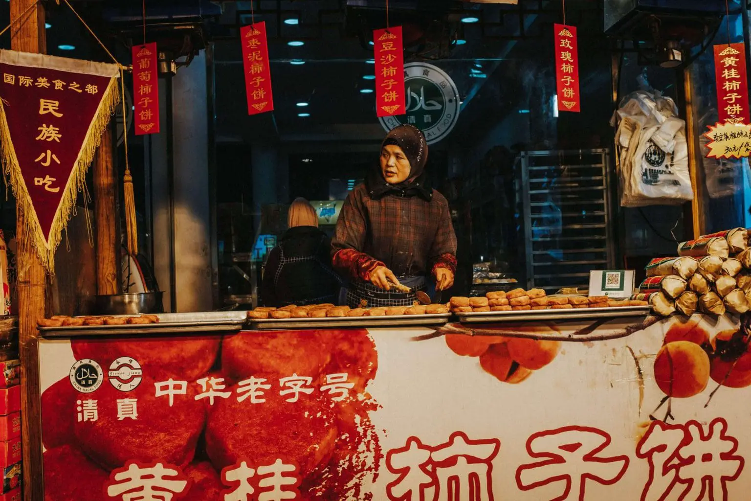Image of woman selling food in the Muslim Quarter in Xian China